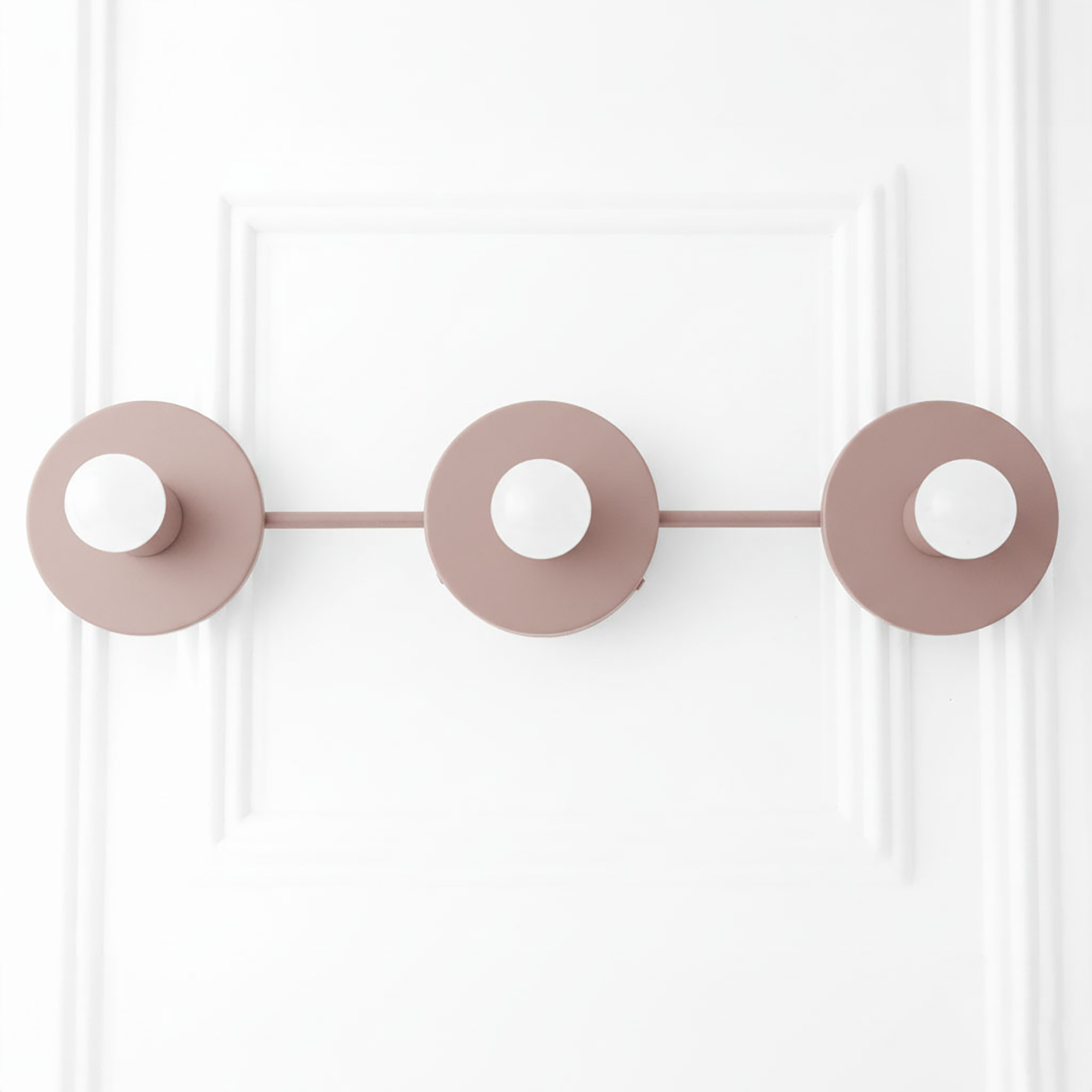 Mid-century modern mauve vanity light with three round flat shades and horizontal bar. - VANITY LIGHT MODEL NO. 5708