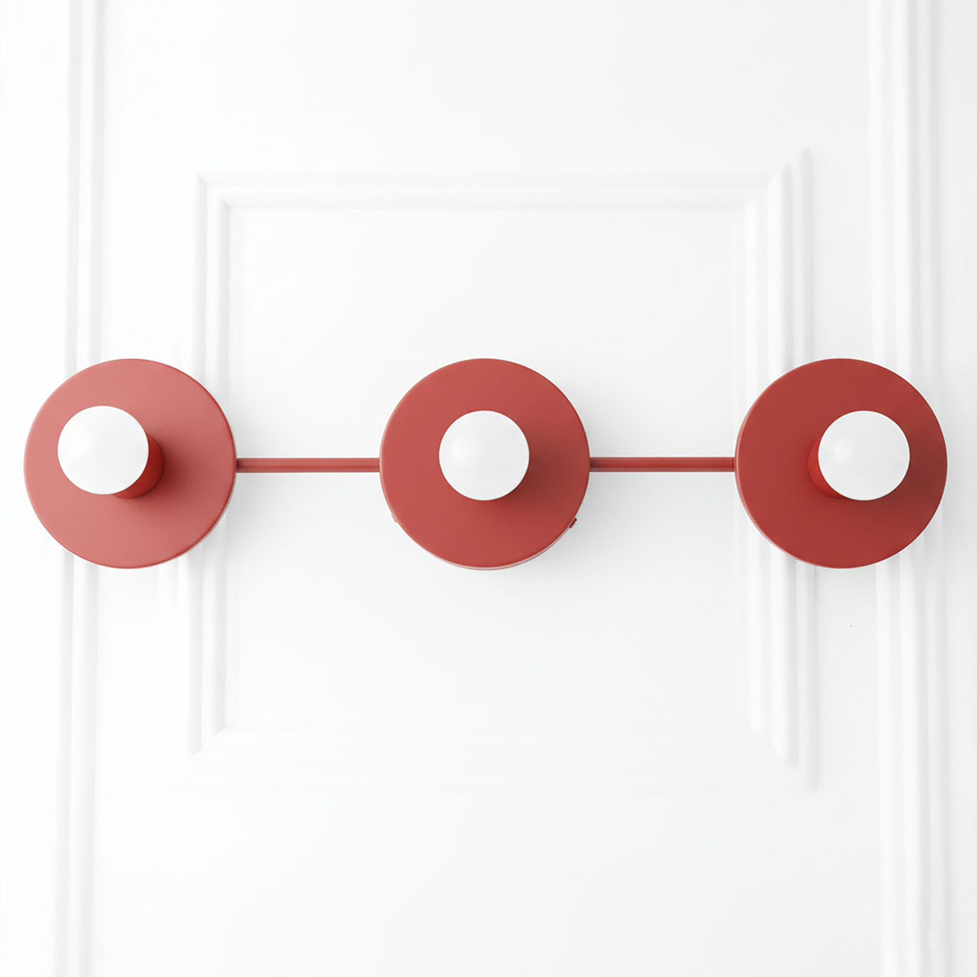 Matte red vanity light with three round bare bulb sockets in a linear mid-century modern design. - VANITY LIGHT MODEL NO. 5708