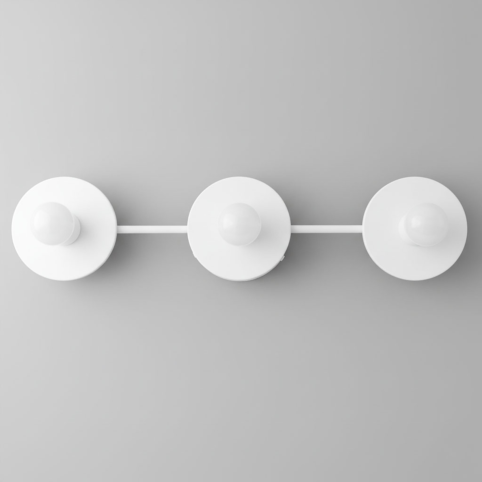 Three white round vanity lights with exposed bulbs and a minimalist horizontal mounting bar. - VANITY LIGHT MODEL NO. 5708