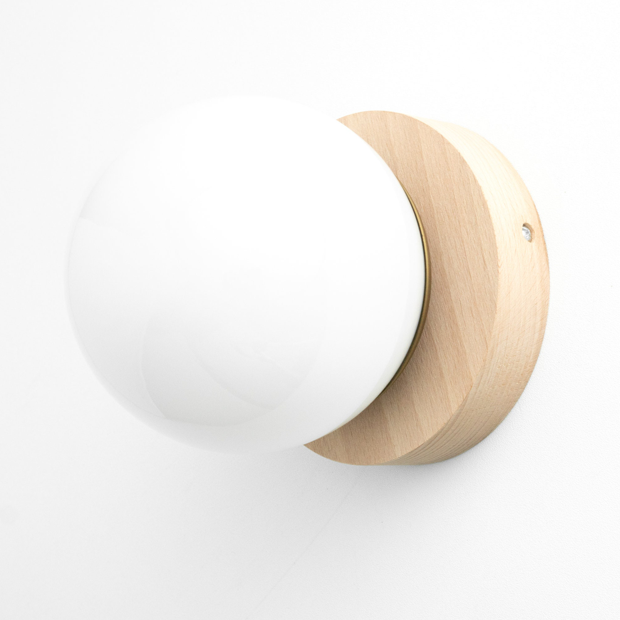 Scandinavian sconce with frosted white glass globe and natural wood round base. - SCONCE MODEL NO. 5719
