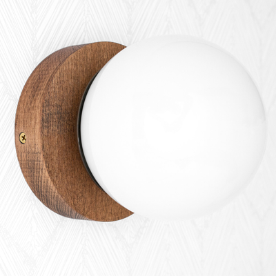 Wall sconce with round white glass globe and natural beechwood base with antique brass fixture. - SCONCE MODEL NO. 5719