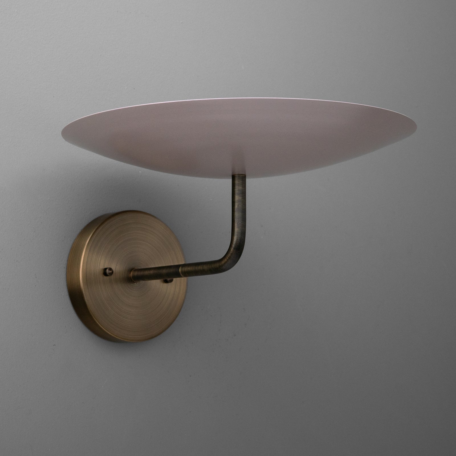 Brushed brass wall sconce with curved arm supporting a wide, shallow frosted glass shade. - SCONCE MODEL NO. 1504