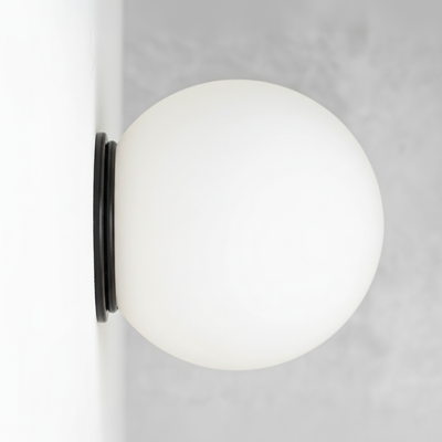 Mid-century modern black flush mount sconce with a white globe shade. - SCONCE MODEL NO. 4037