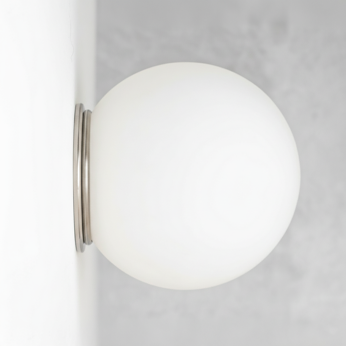 Mid-century modern polished nickel wall sconce with a white frosted glass globe shade flush mounted. - SCONCE MODEL NO. 4037