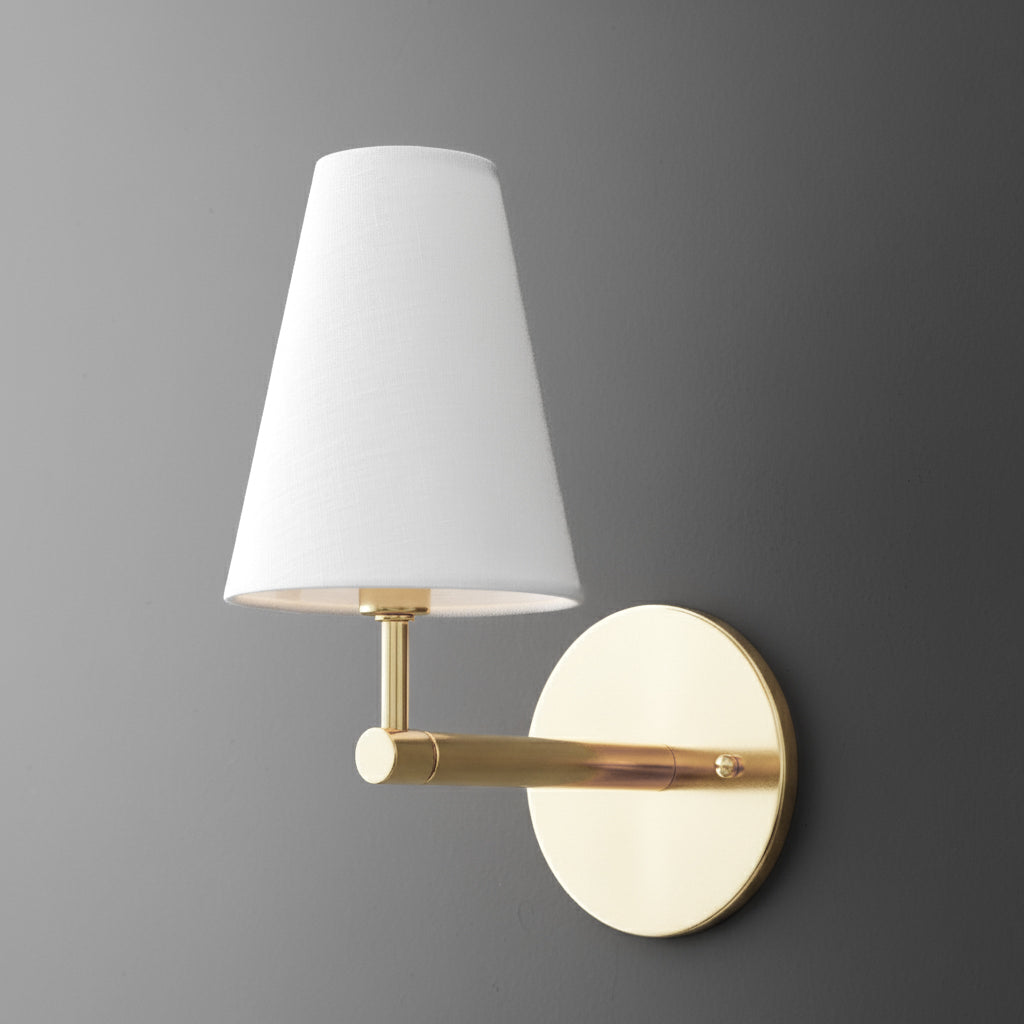 Wall-mounted sconce with a round brass base and a white tapered fabric lampshade. - SCONCE MODEL NO. 1014