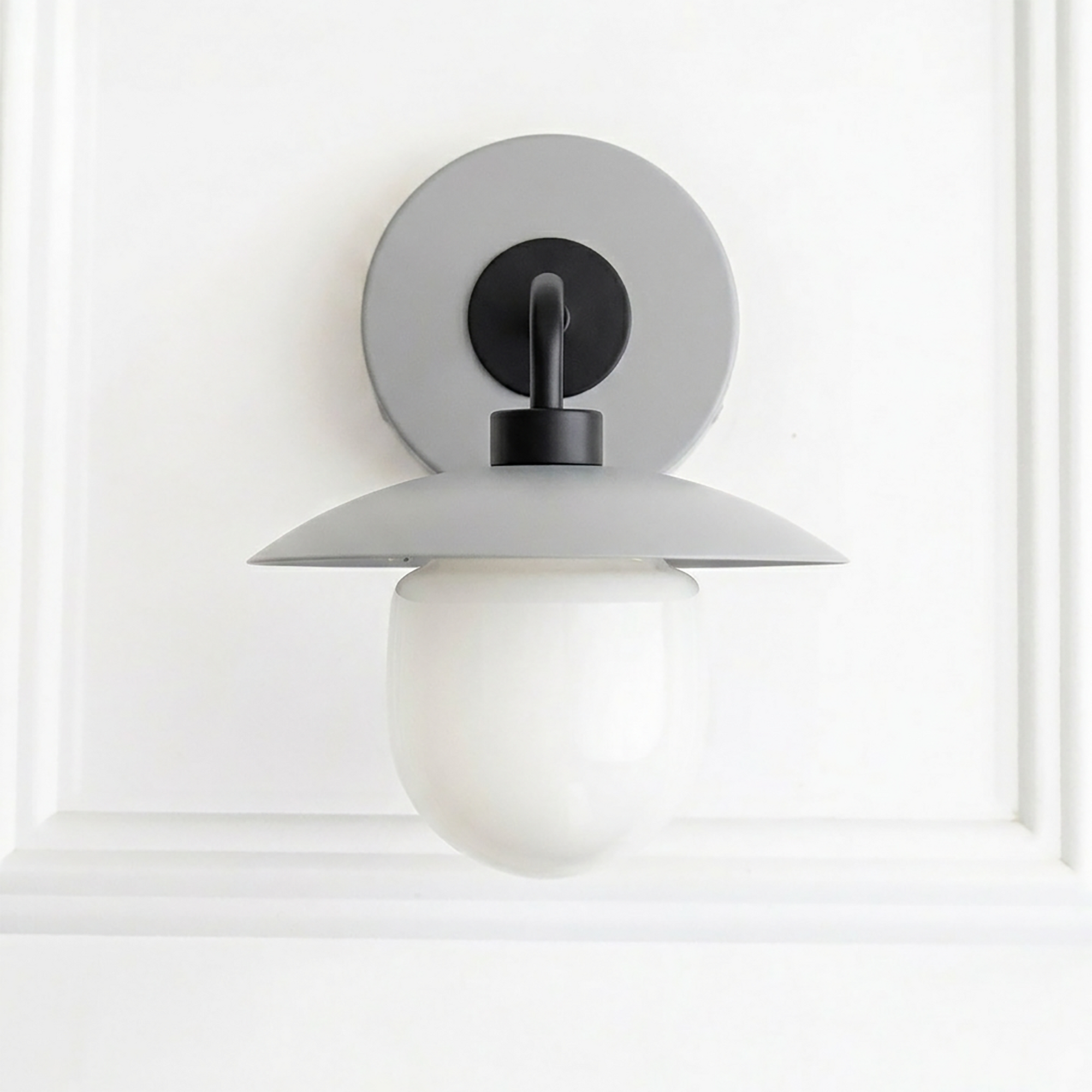 Mid-century modern wall sconce with matte gray metal shade and white frosted globe bulb cover. - SCONCE MODEL NO. 7039