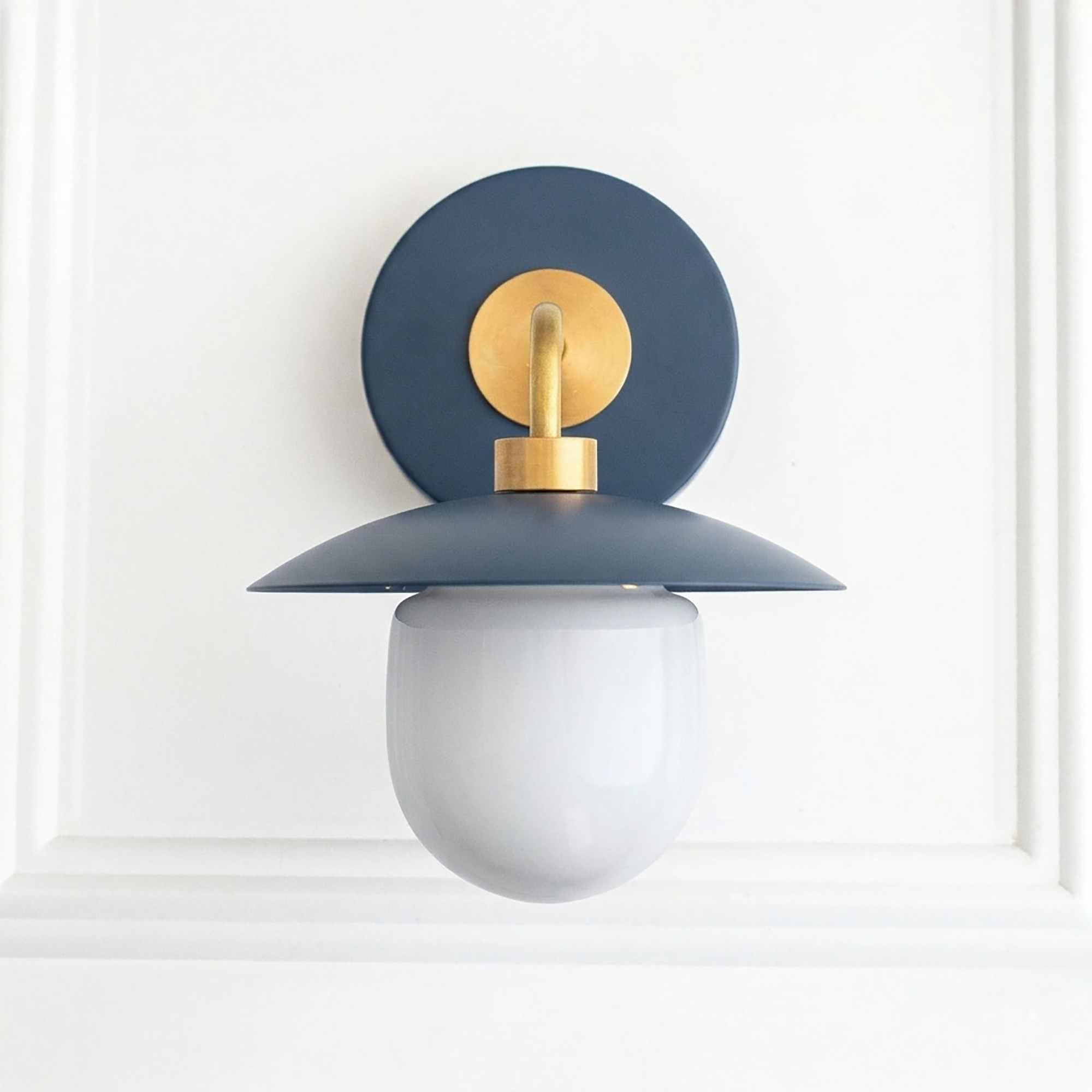 Mid-century modern wall sconce with matte blue metal shade, brass accents, and white globe bulb. - SCONCE MODEL NO. 7039