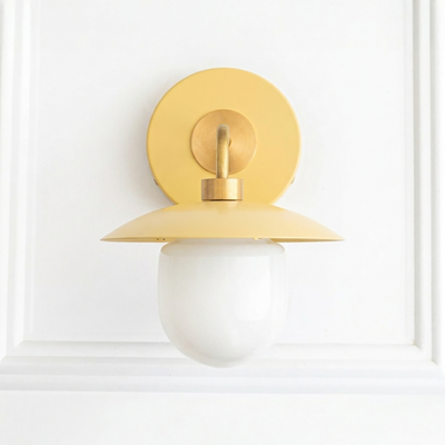 Yellow metal semi-flush sconce with round backplate and white globe shade in mid-century modern style. - SCONCE MODEL NO. 7039