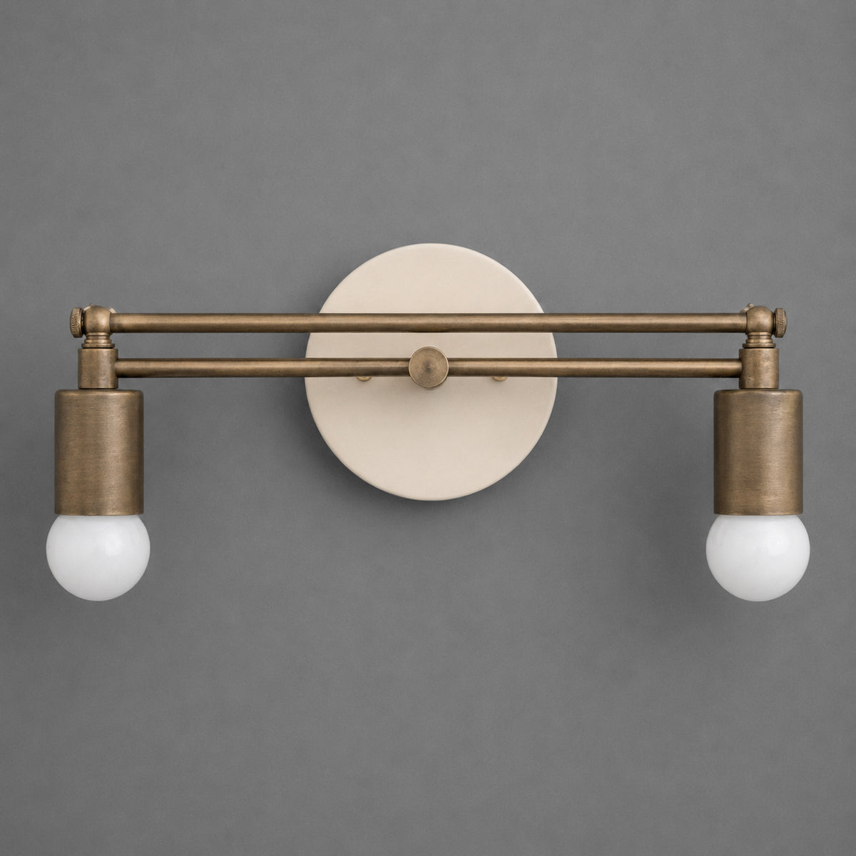 Matte bronze double-bulb vanity light with cylindrical sockets and round wall mount. - VANITY LIGHT MODEL NO. 2360
