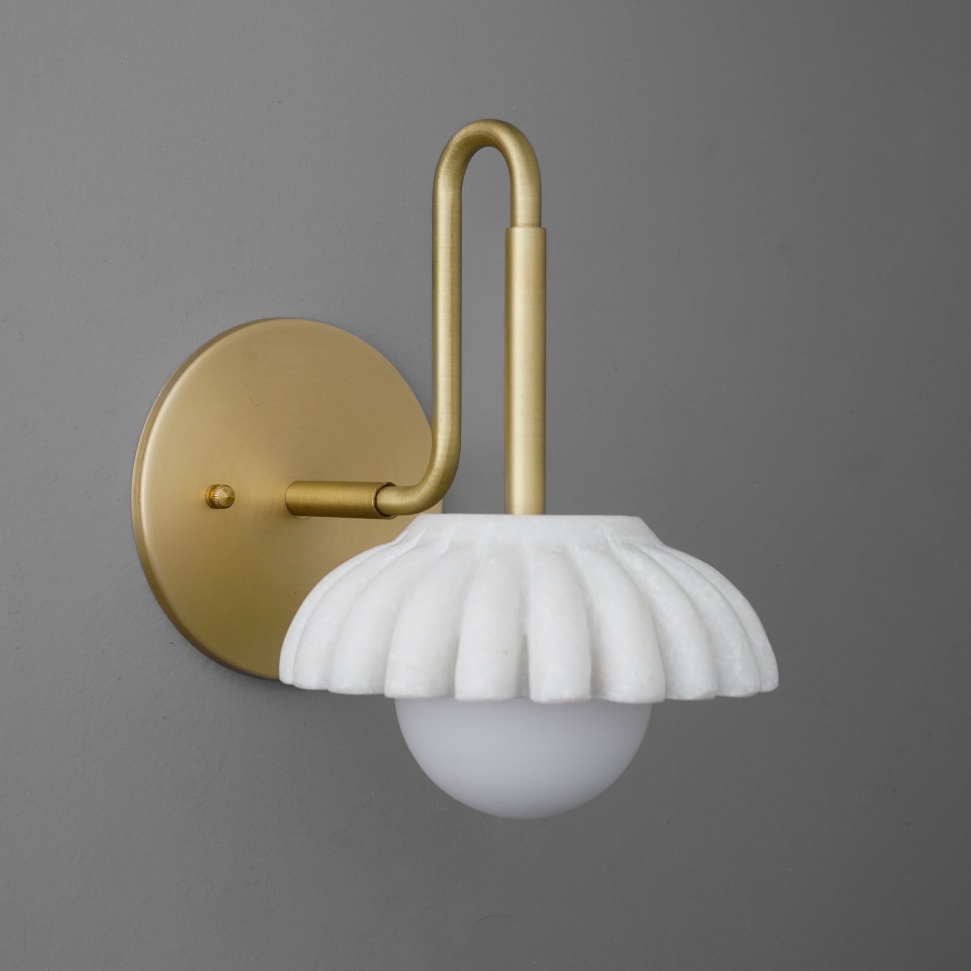 Matte gold metal wall sconce with scalloped white ceramic shade and round frosted glass bulb. - SCONCE MODEL NO. 8633