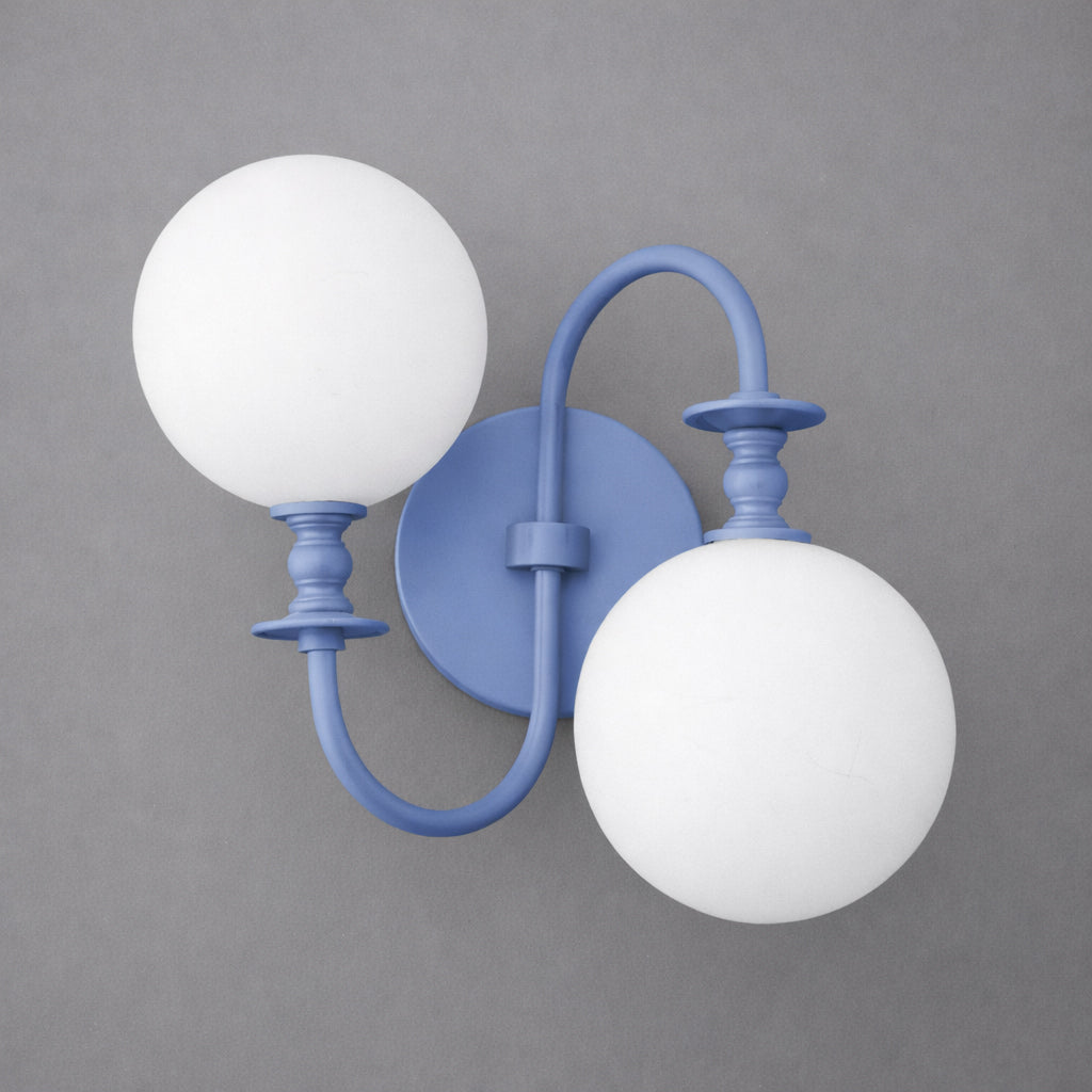 Blue metal wall sconce with two white frosted glass globe lights and curved arms. - SCONCE MODEL NO. 2429