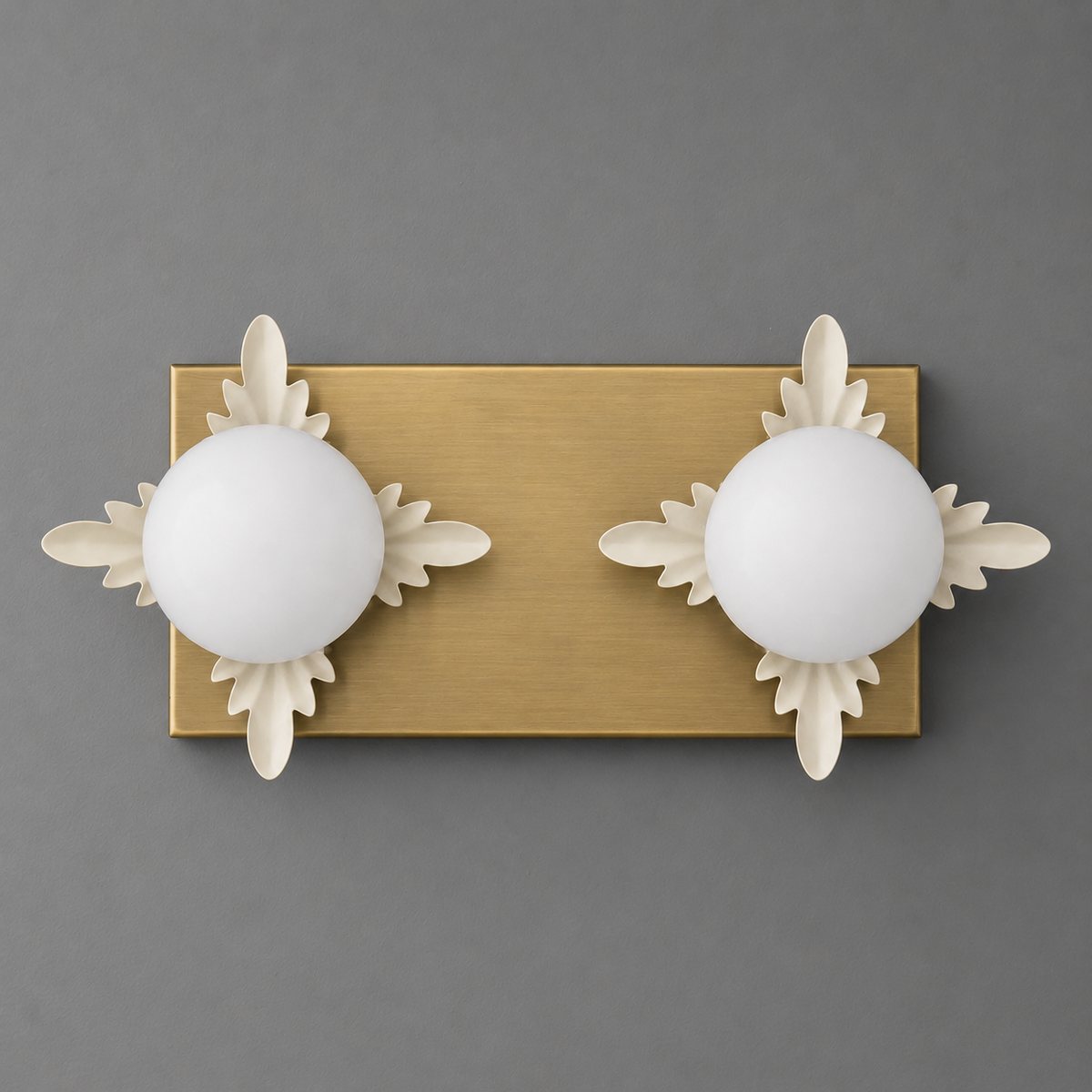 Brushed brass rectangular wall plate with two white spherical glass shades and decorative leaf accents. - SCONCE MODEL NO. 1114