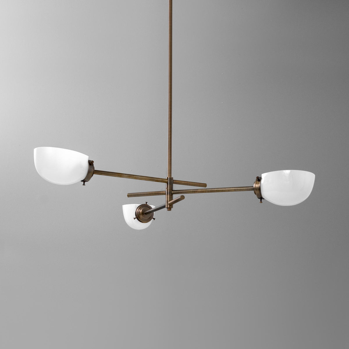 Three-light chandelier in Antique Brass with cup shades on offset crossed arms. - CHANDELIER MODEL NO. 5879