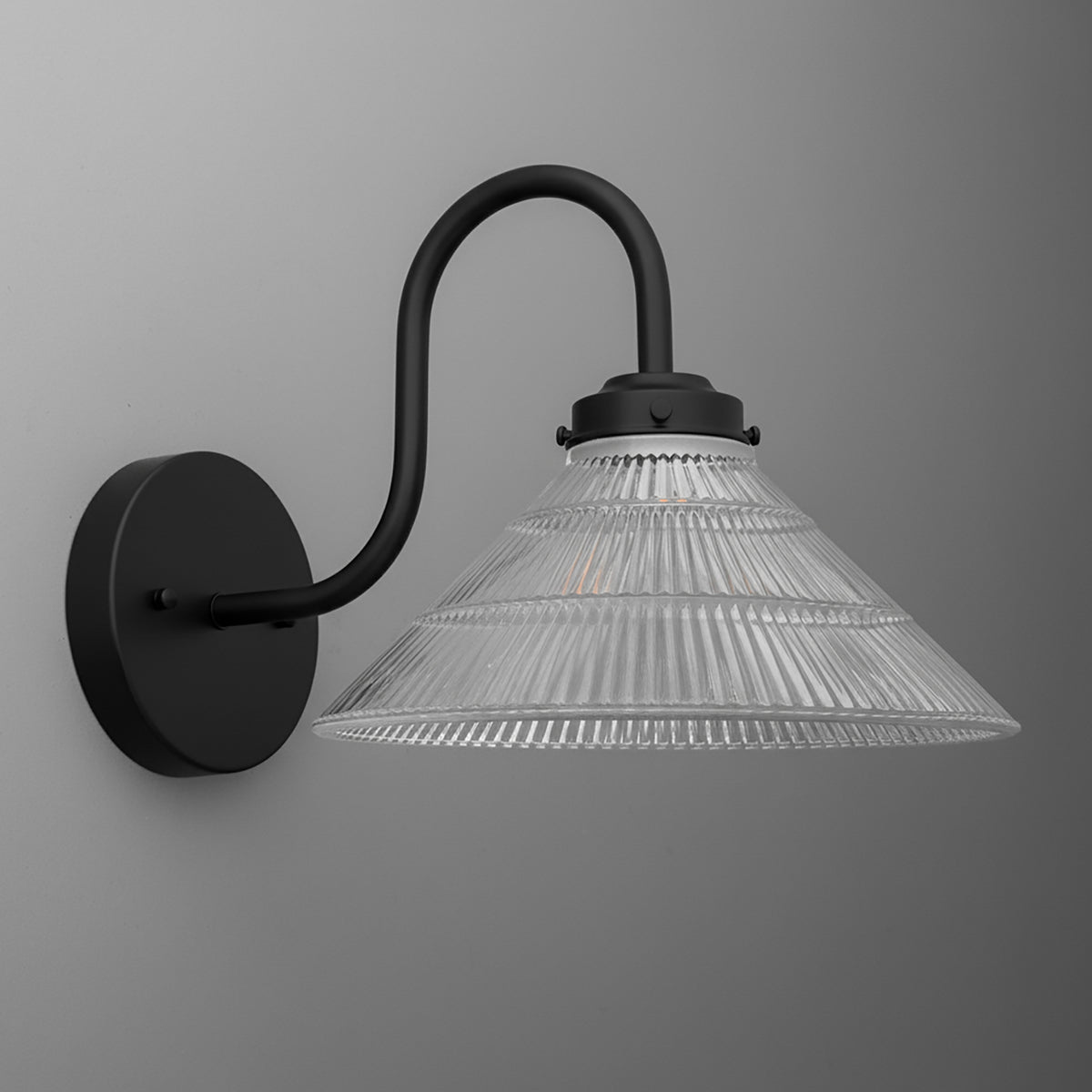 Black metal wall sconce with curved arm and clear ribbed glass conical shade. - SCONCE MODEL NO. 6263