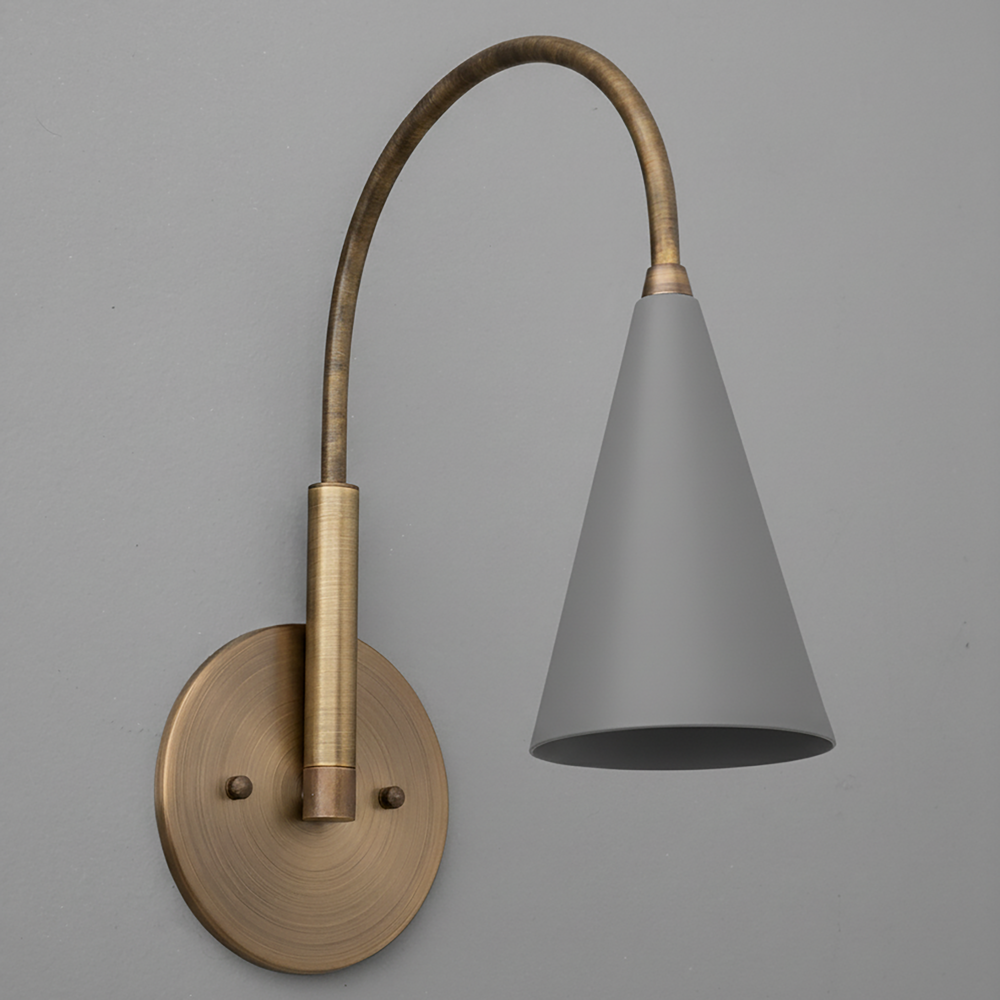 Wall sconce with brushed brass round mount and curved arm, matte gray conical metal shade. - SCONCE MODEL NO. 1309