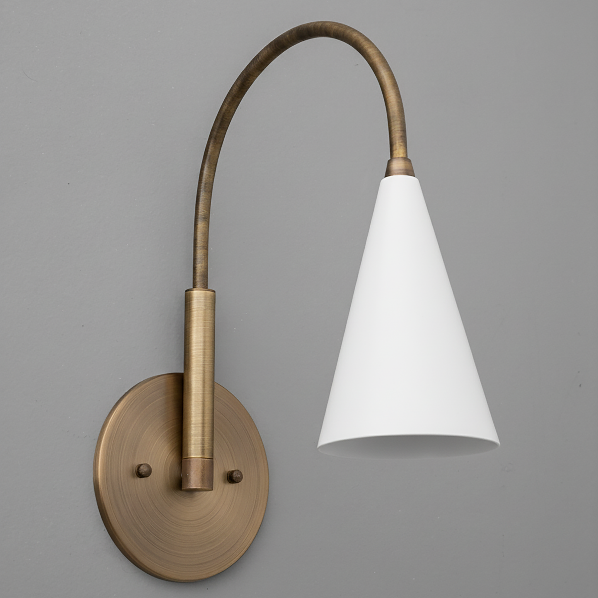 Antique brass wall sconce with curved arm and white conical glass shade. - SCONCE MODEL NO. 1309
