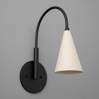 Black metal wall sconce with a curved arm and a white conical lampshade mounted on a round base. - SCONCE MODEL NO. 1309