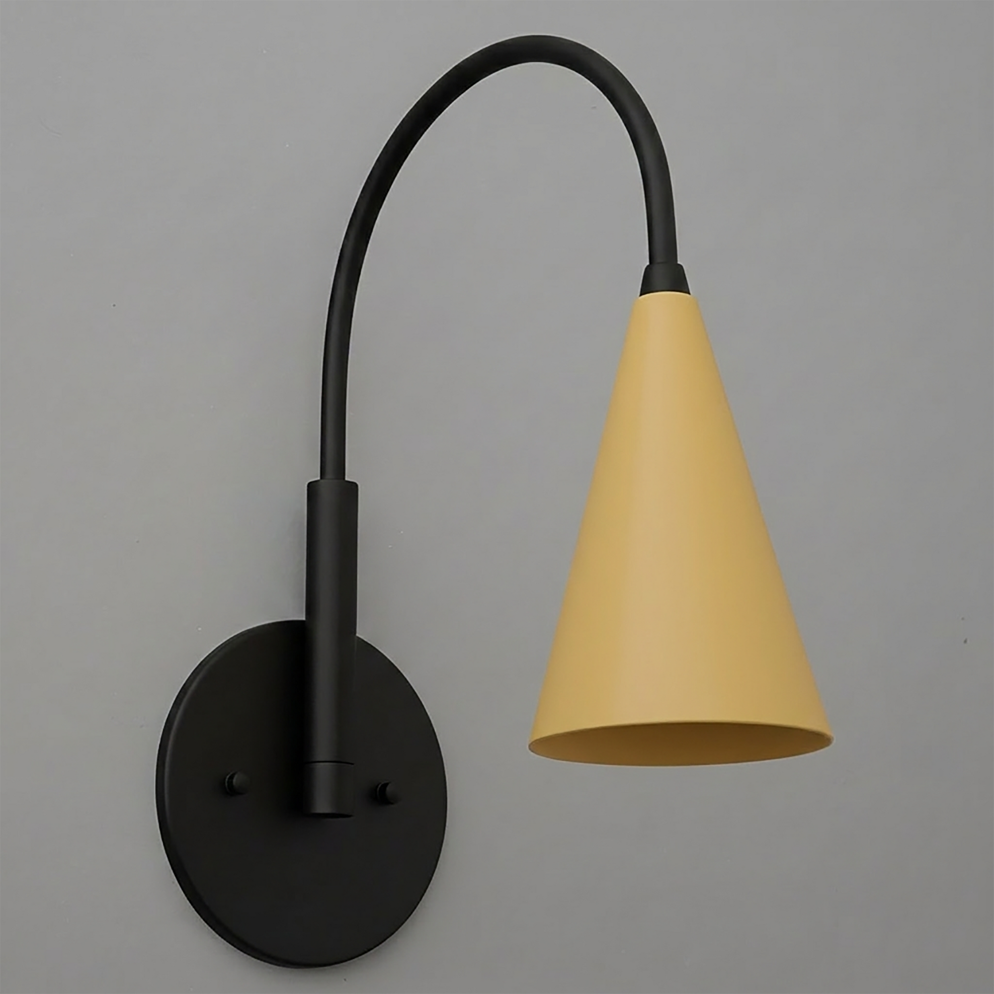 Matte black metal wall sconce with flexible arm and smooth yellow conical shade. - SCONCE MODEL NO. 1309