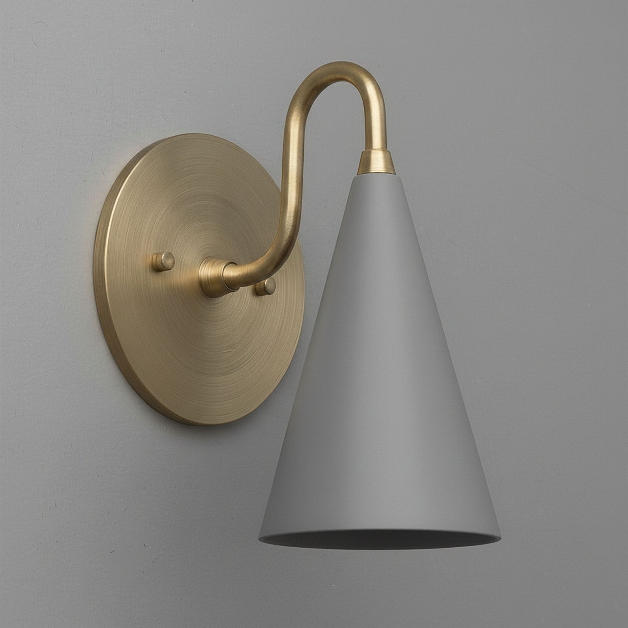 Wall-mounted sconce with antique brass base and gray conical shade. - Sconce Model No. 2900