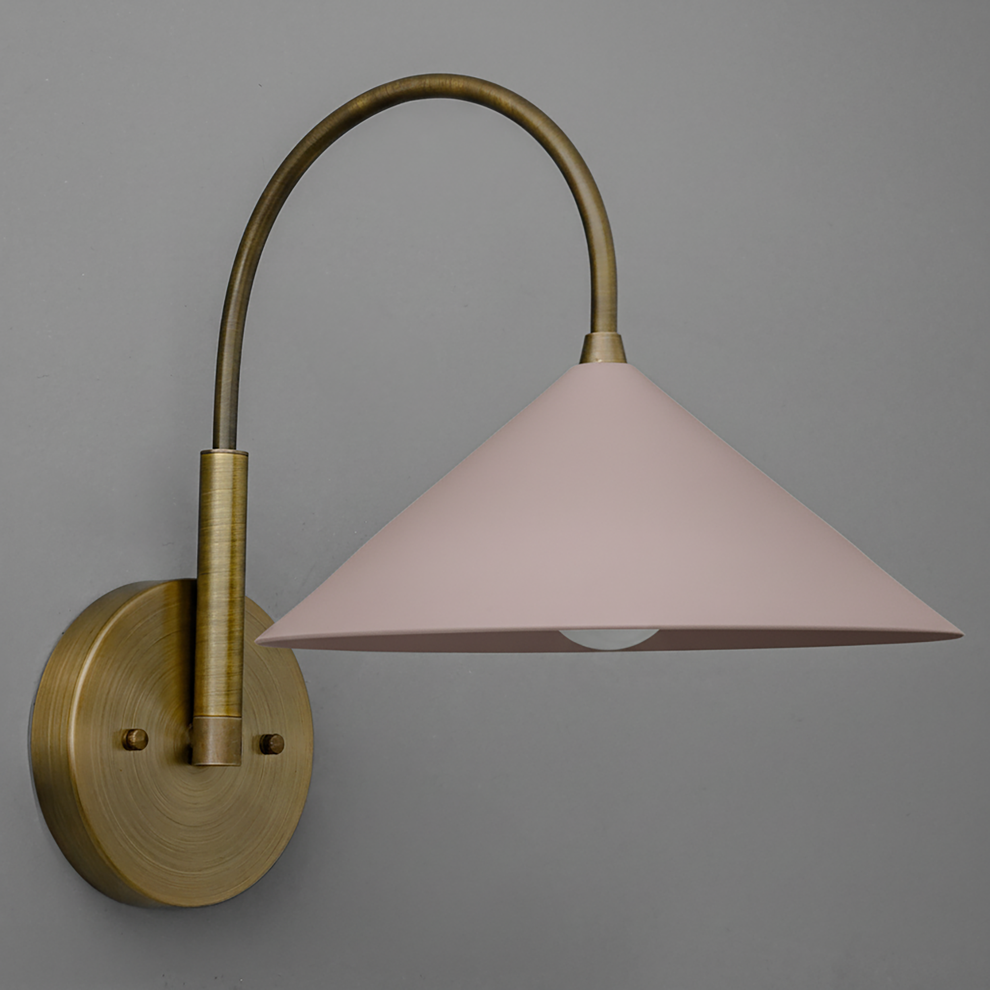 Antique brass sconce with curved arm and mauve conical shade. - Sconce Model No. 1583