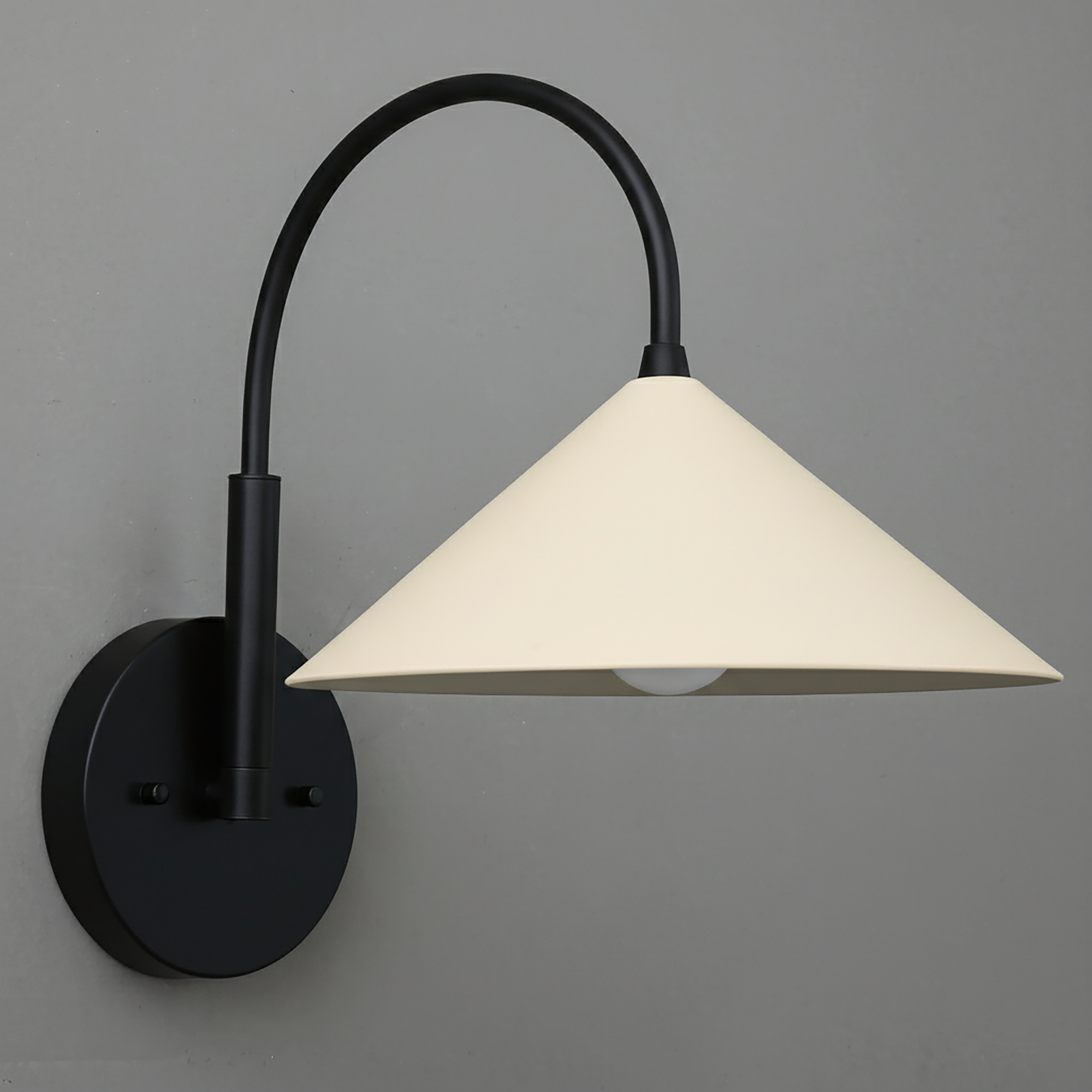 Black metal wall sconce with curved arm and cream conical shade. - Sconce Model No. 1583
