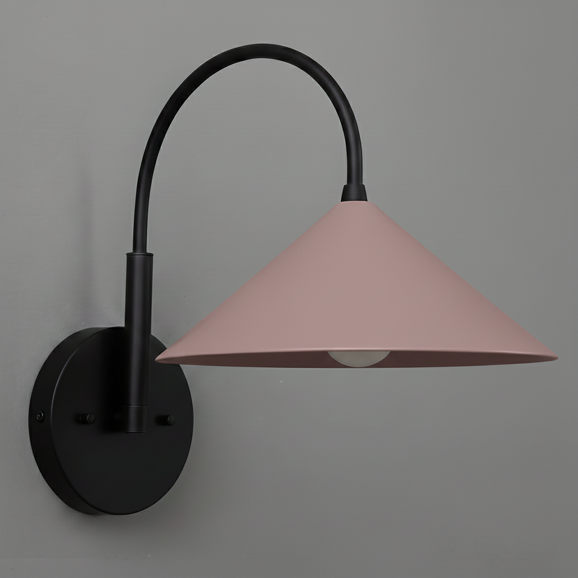 Black metal wall sconce with curved arm and mauve cone-shaped shade. - Sconce Model No. 1583