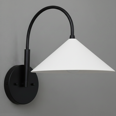 Black metal wall sconce with curved arm and white conical shade mounted on gray wall. - Sconce Model No. 1583