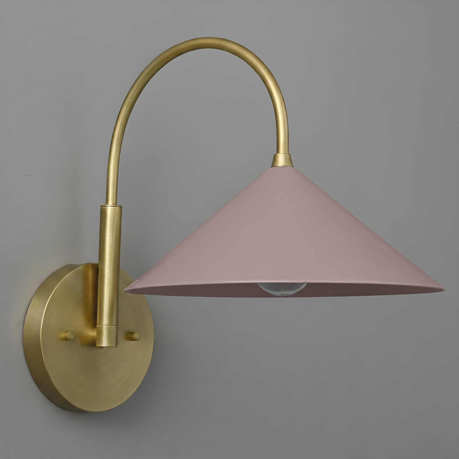 Antique brass wall sconce with mauve conical shade and curved arm design. - Sconce Model No. 1583