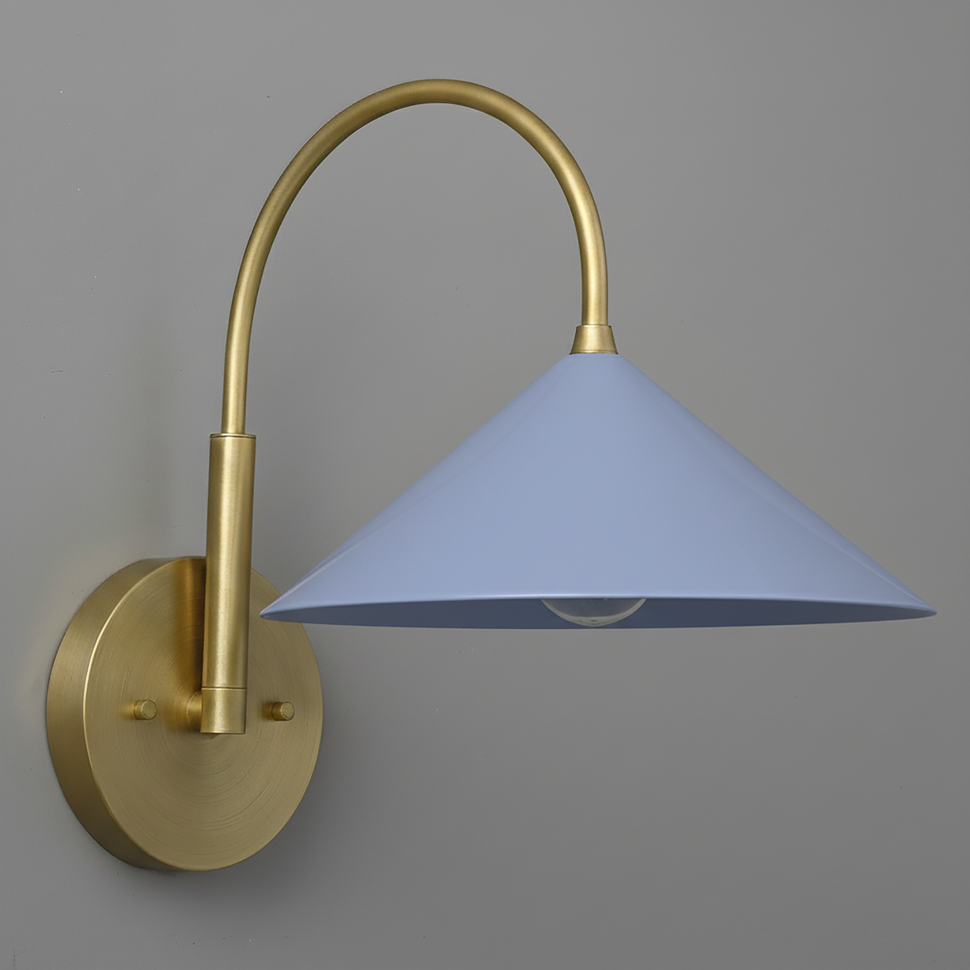 Antique brass sconce with curved arm and periwinkle conical shade on round wall mount. - Sconce Model No. 1583