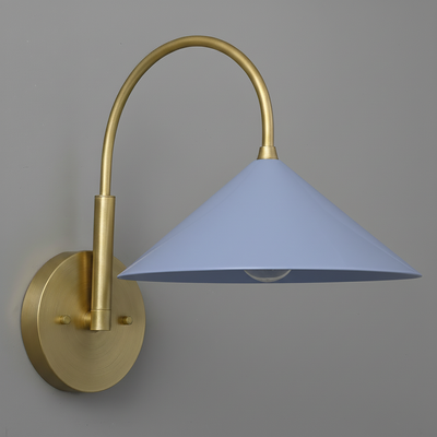 Antique brass sconce with curved arm and periwinkle conical shade on round wall mount. - Sconce Model No. 1583