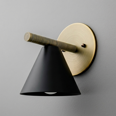 Wall sconce with matte black conical shade and brushed brass round mounting plate and arm. - SCONCE MODEL NO. 5075