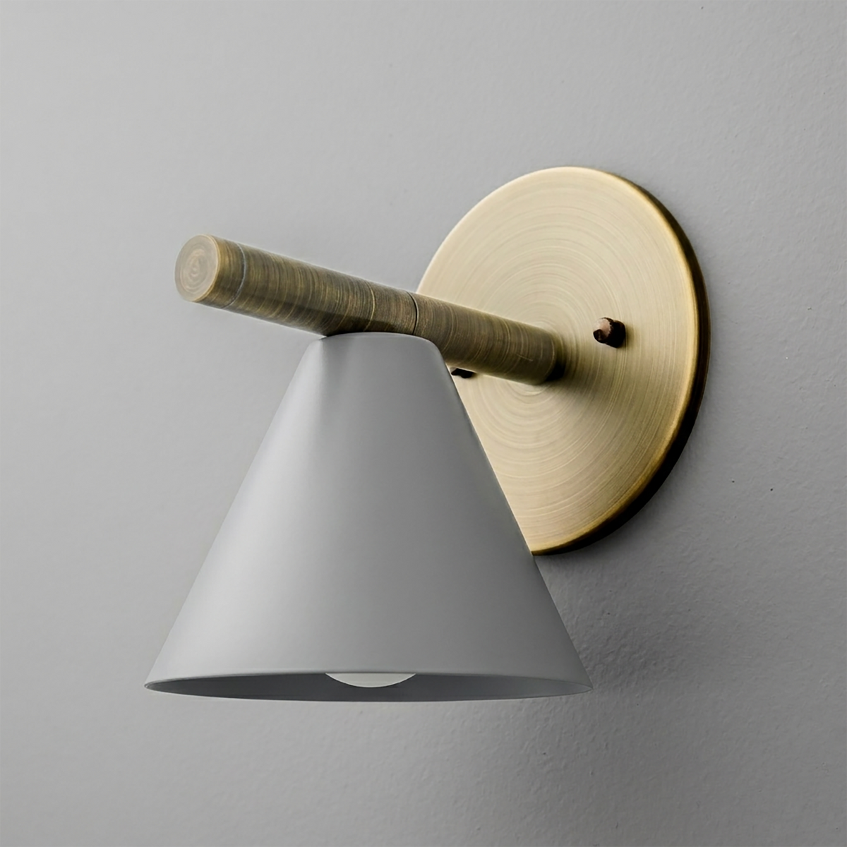 Wall sconce with matte gray conical shade, brass circular backplate, and horizontal brass arm. - SCONCE MODEL NO. 5075
