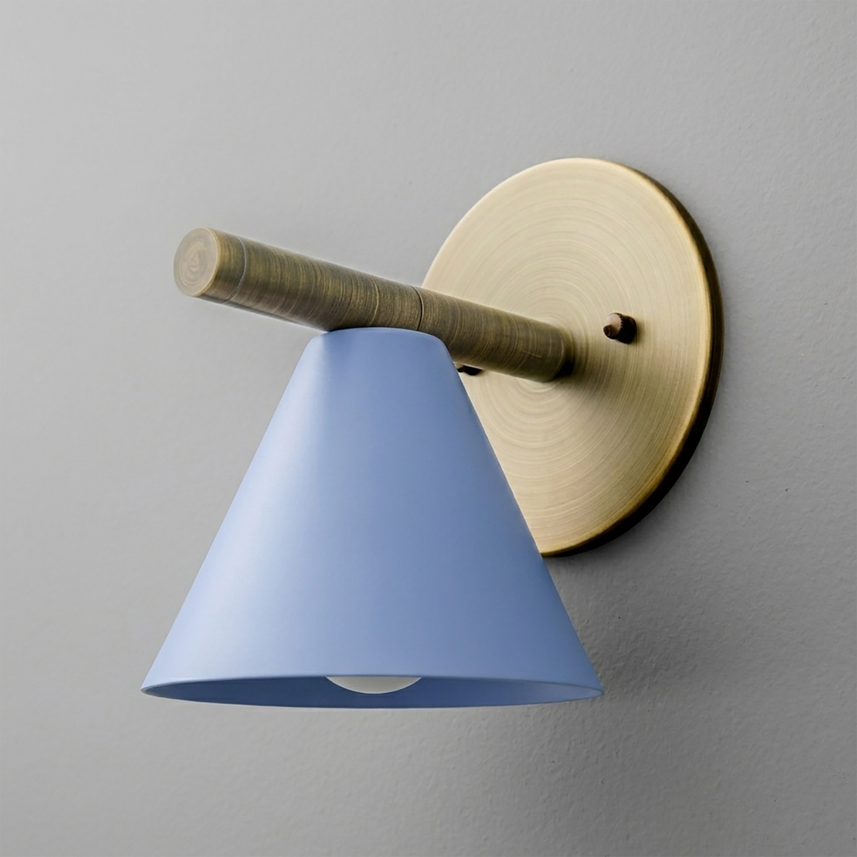 Wall-mounted sconce with brushed brass circular base and arm, featuring a matte blue cone-shaped shade. - SCONCE MODEL NO. 5075