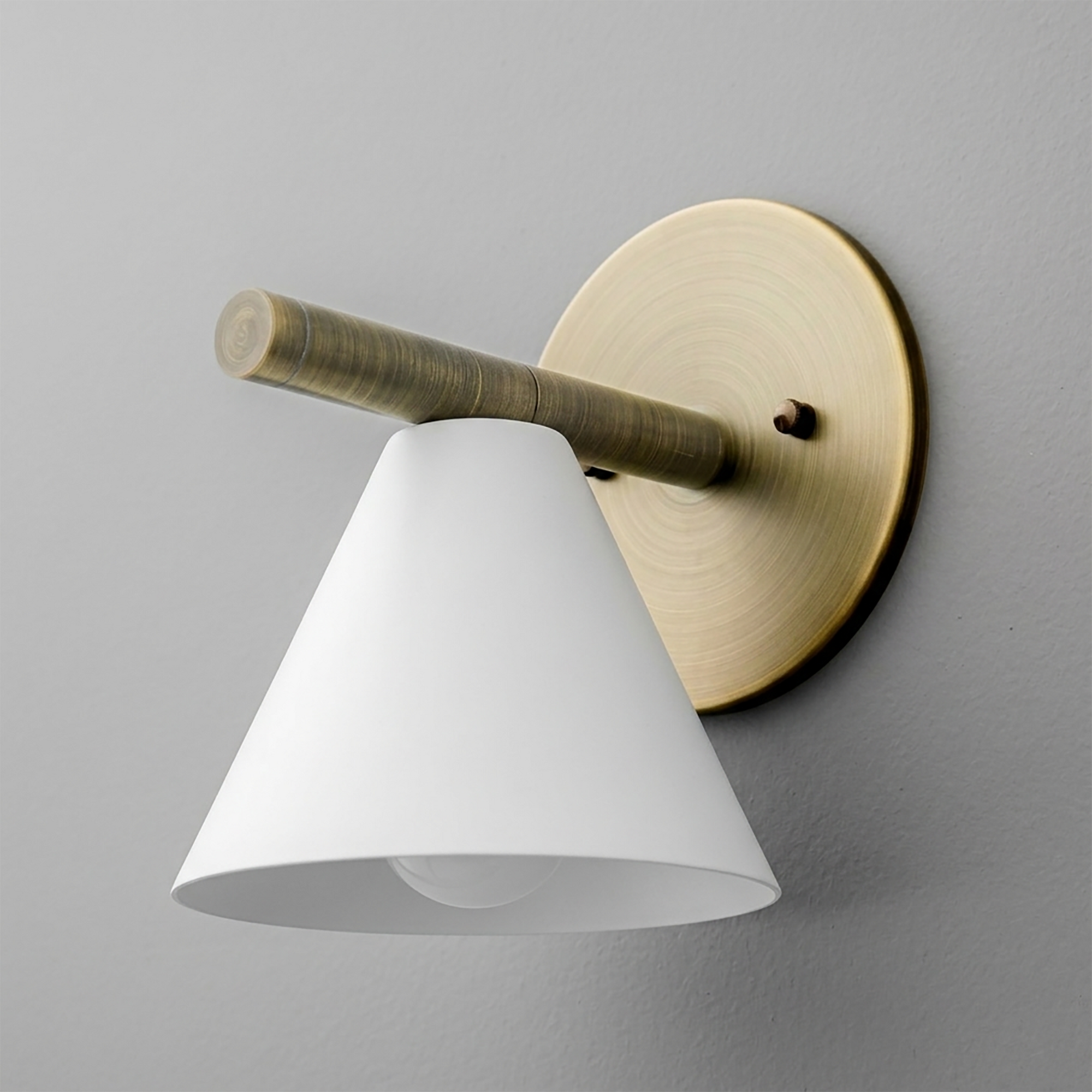 Brushed brass wall sconce with cylindrical arm and white conical metal shade. - SCONCE MODEL NO. 5075