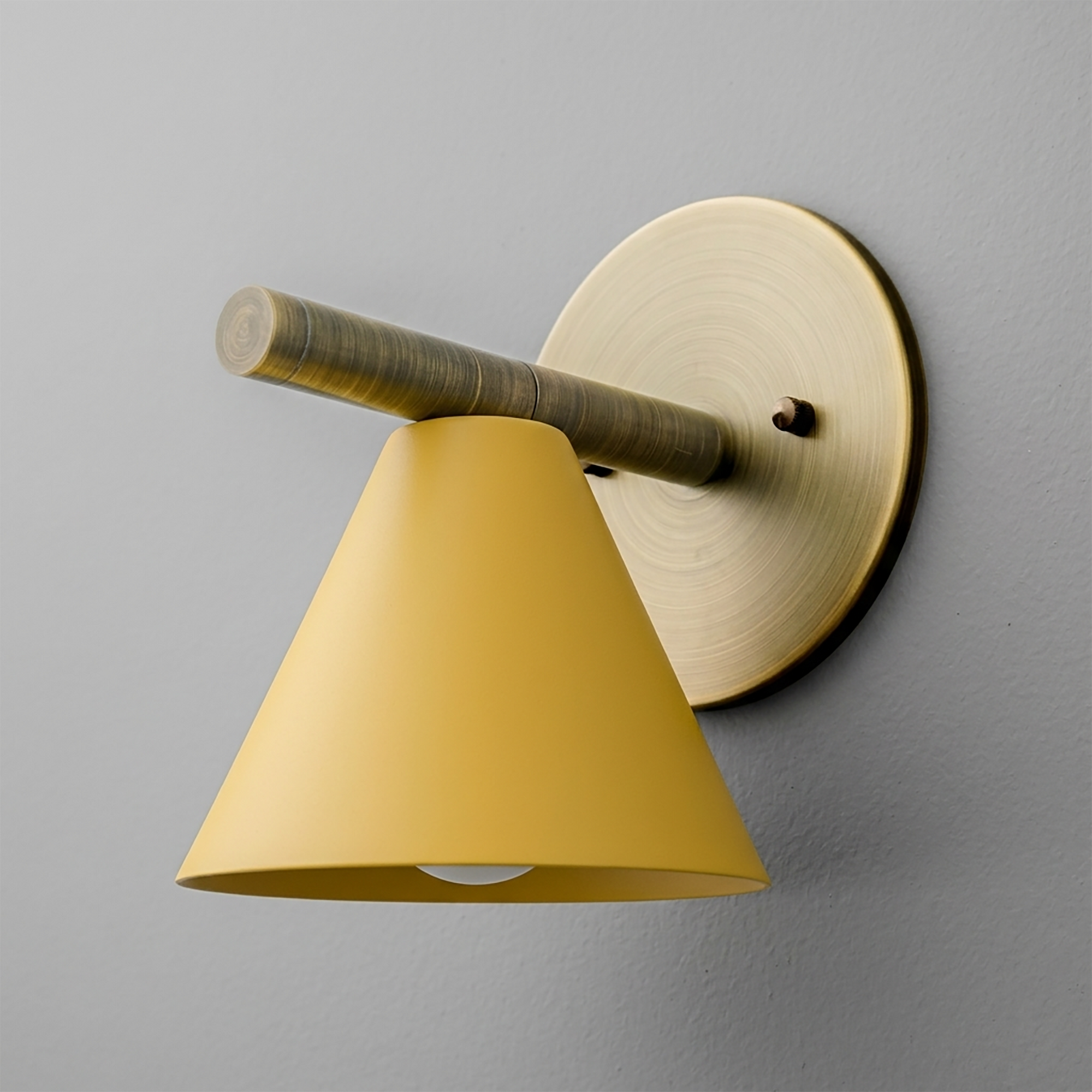 Matte yellow conical shade sconce with brushed brass circular wall mount and horizontal arm. - SCONCE MODEL NO. 5075