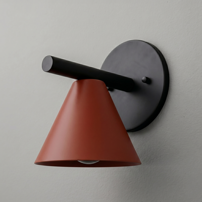 Matte black metal wall sconce with a terracotta-colored conical shade and round backplate. - SCONCE MODEL NO. 5075