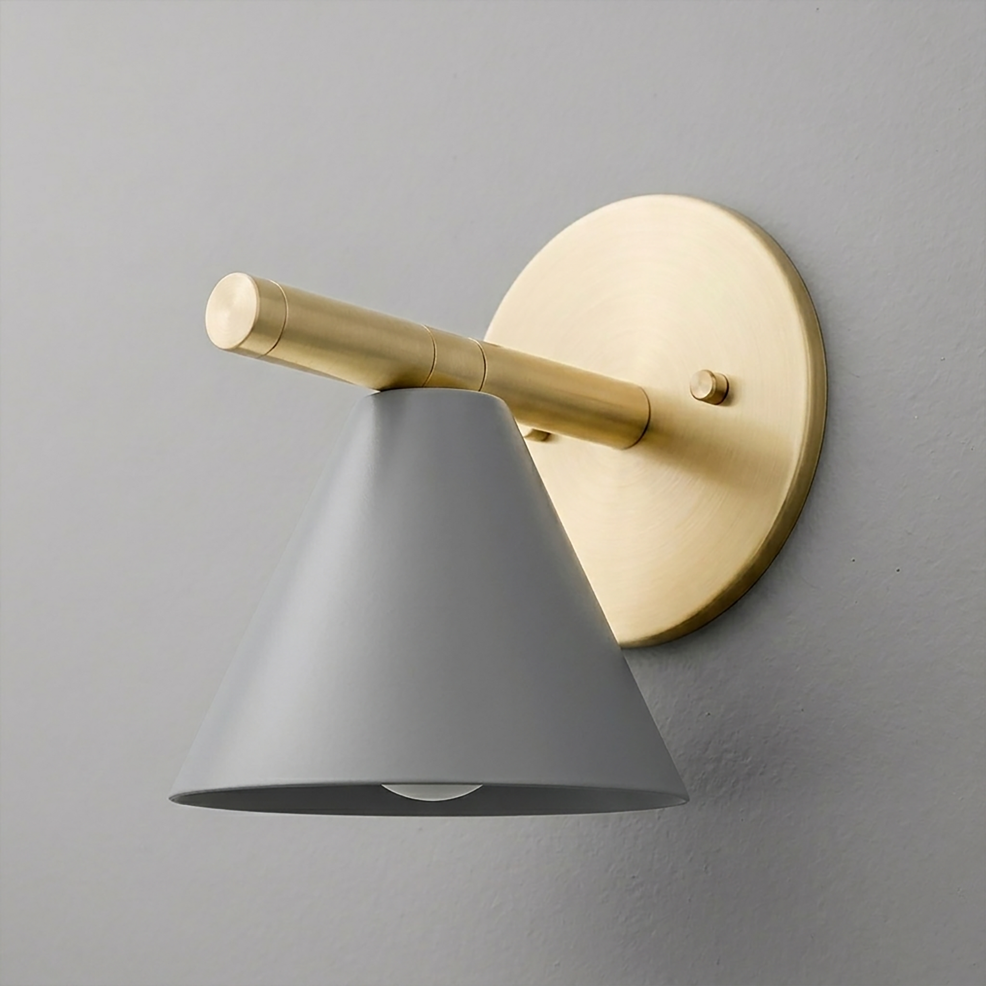 Wall sconce with matte gray conical shade and brushed brass round mount and arm. - SCONCE MODEL NO. 5075