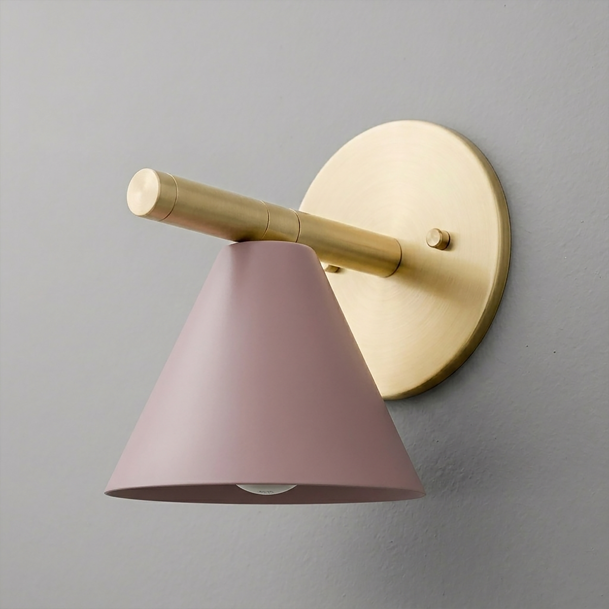 Brushed brass wall sconce with round backplate and conical matte pink metal shade. - SCONCE MODEL NO. 5075