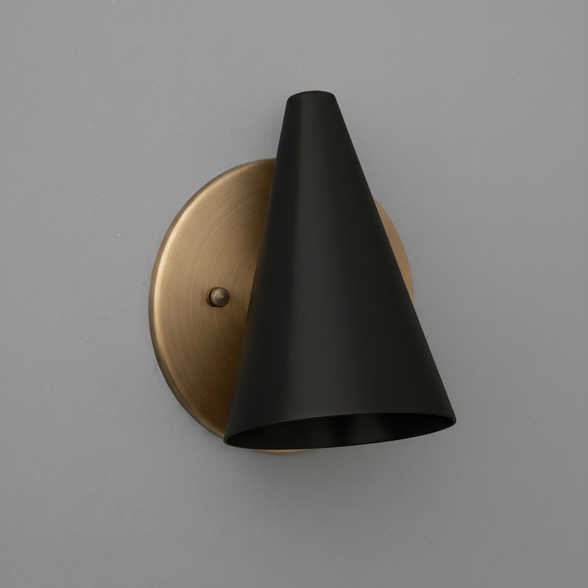 Matte black conical metal sconce with brushed brass circular wall mount and single bulb fixture. - SCONCE MODEL NO. 5950