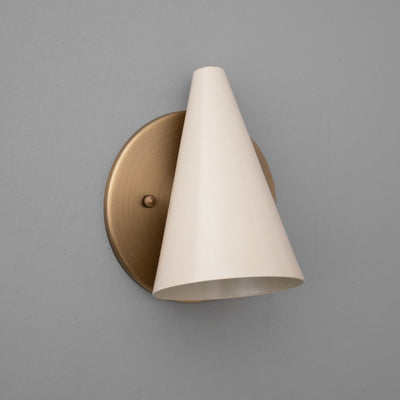 Wall sconce with angled cream cone-shaped shade and round bronze metal base. - SCONCE MODEL NO. 5950