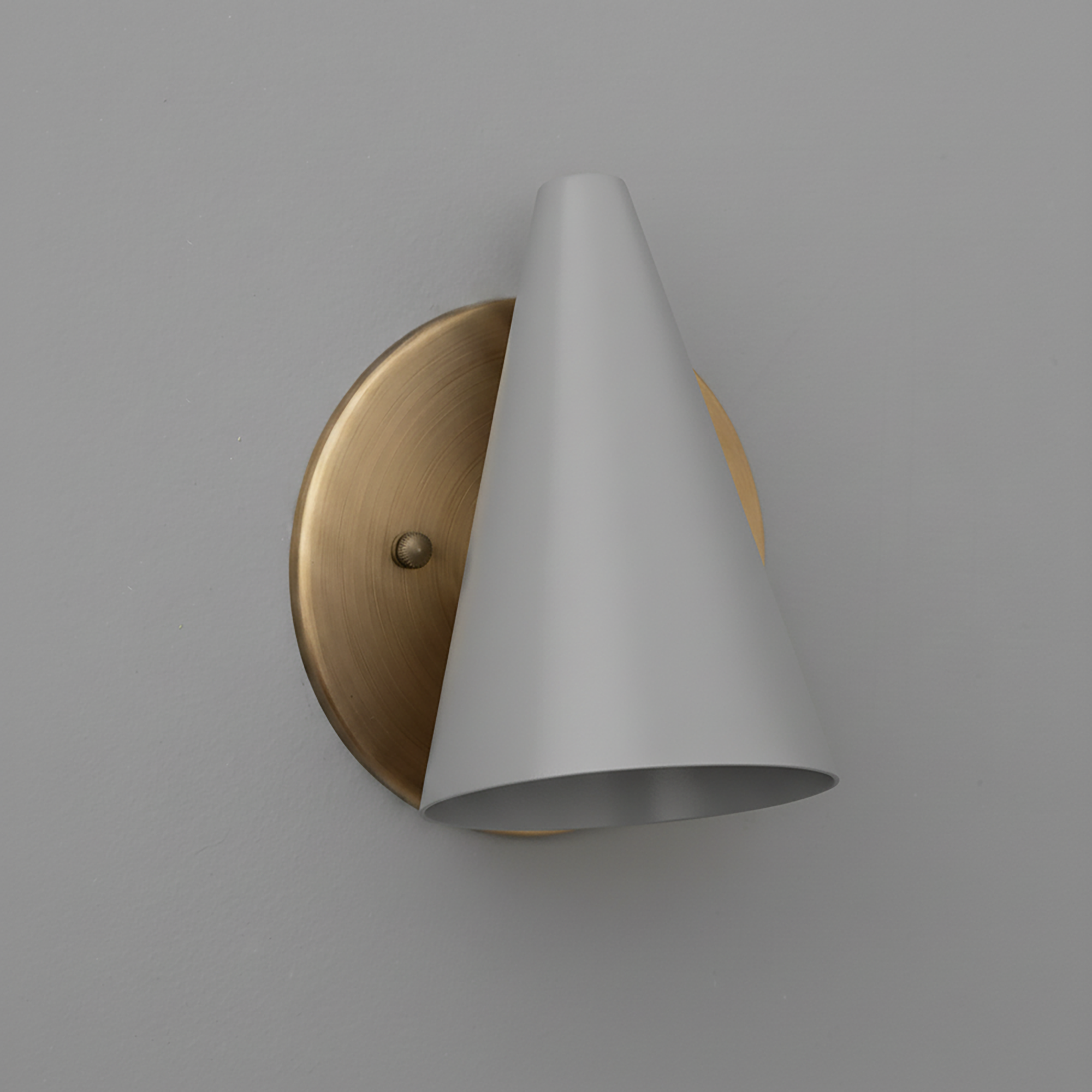 Wall sconce with matte white conical shade and round brushed brass backplate. - SCONCE MODEL NO. 5950