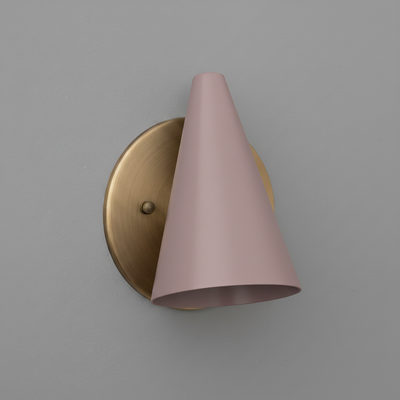 Matte pink conical metal sconce shade mounted on a round brushed brass wall plate with single bulb fixture. - SCONCE MODEL NO. 5950