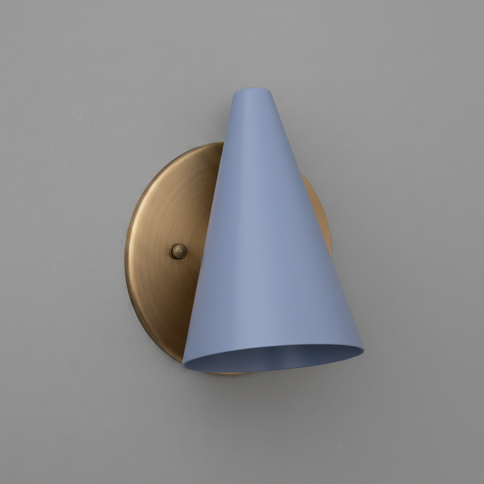 Wall-mounted sconce with a matte brass round base and a conical light blue metal shade. - SCONCE MODEL NO. 5950
