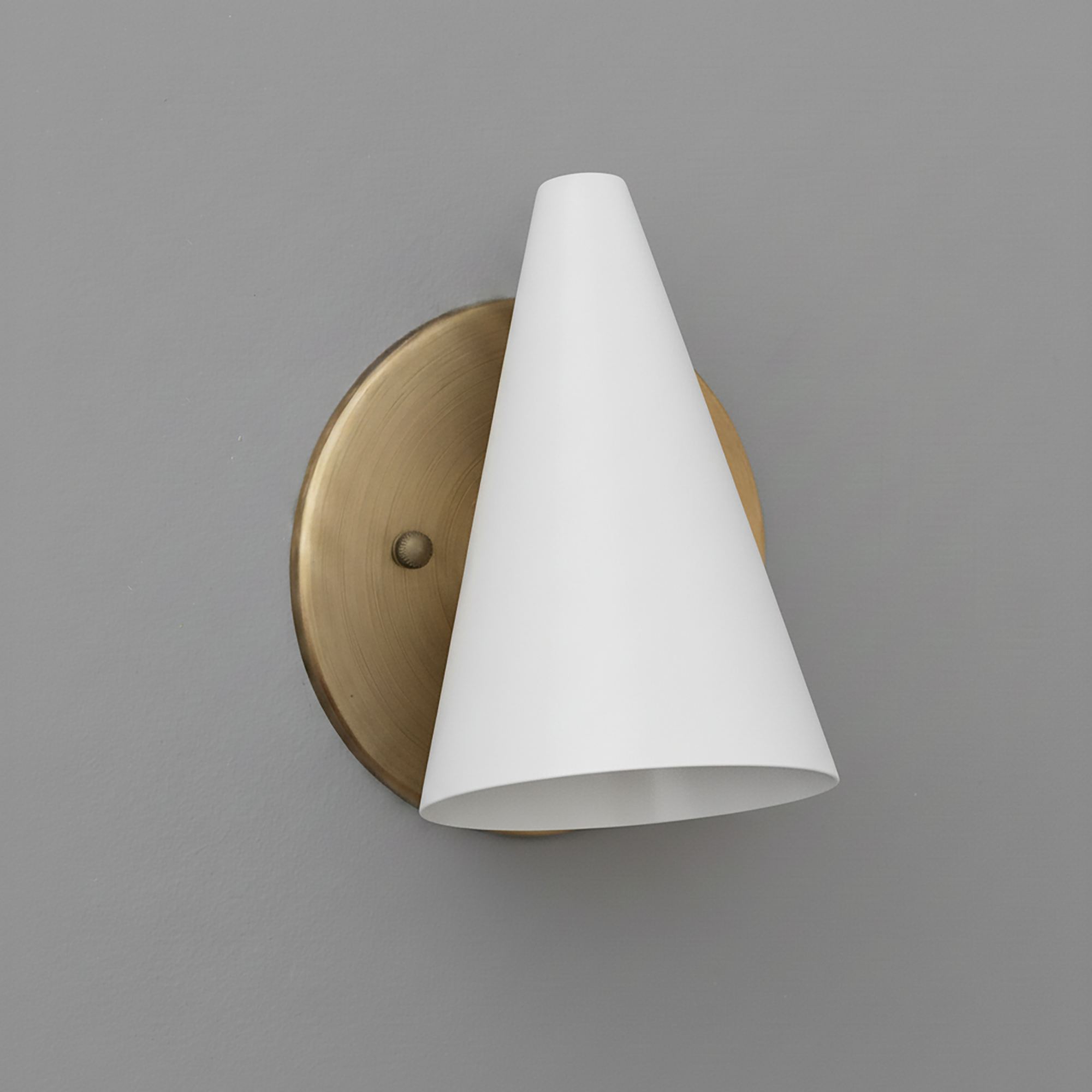 Wall sconce with white conical shade and round brushed brass backplate. - SCONCE MODEL NO. 5950
