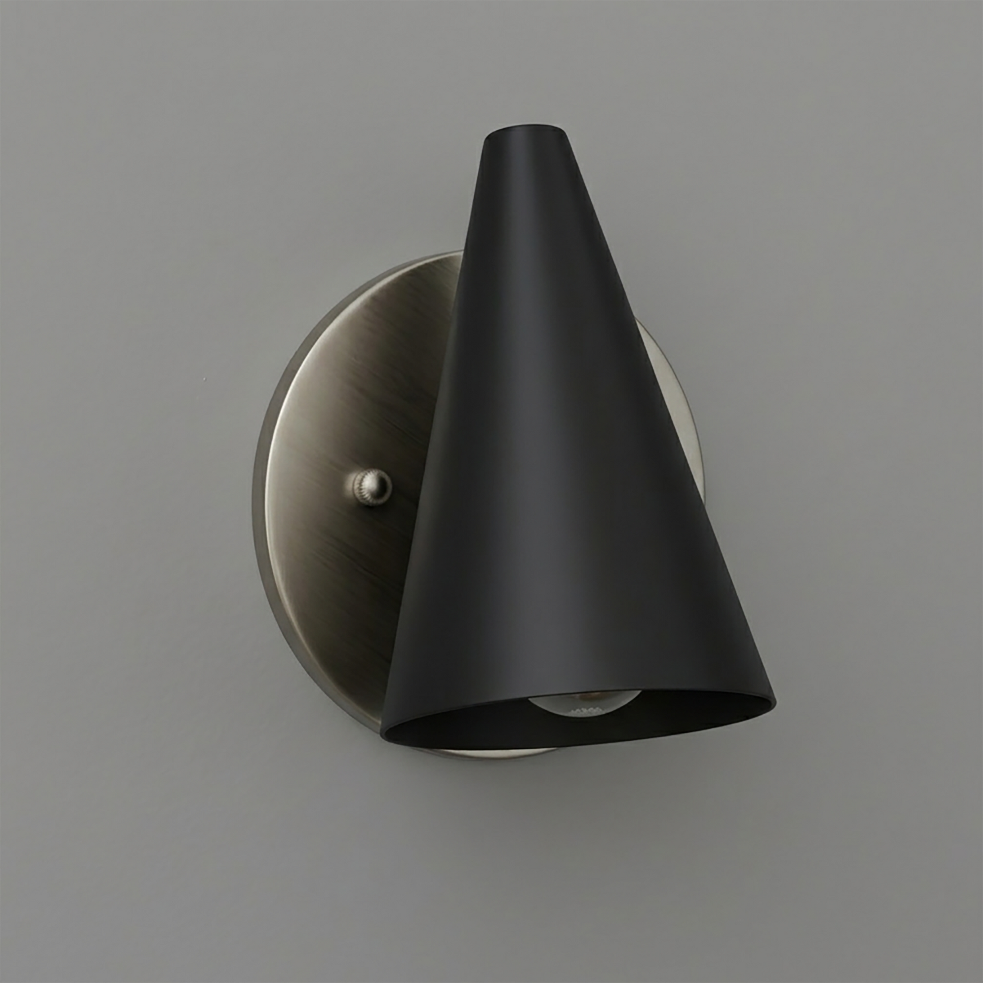Modern black cone-shaped metal sconce with brushed nickel round backplate and single bulb. - SCONCE MODEL NO. 5950
