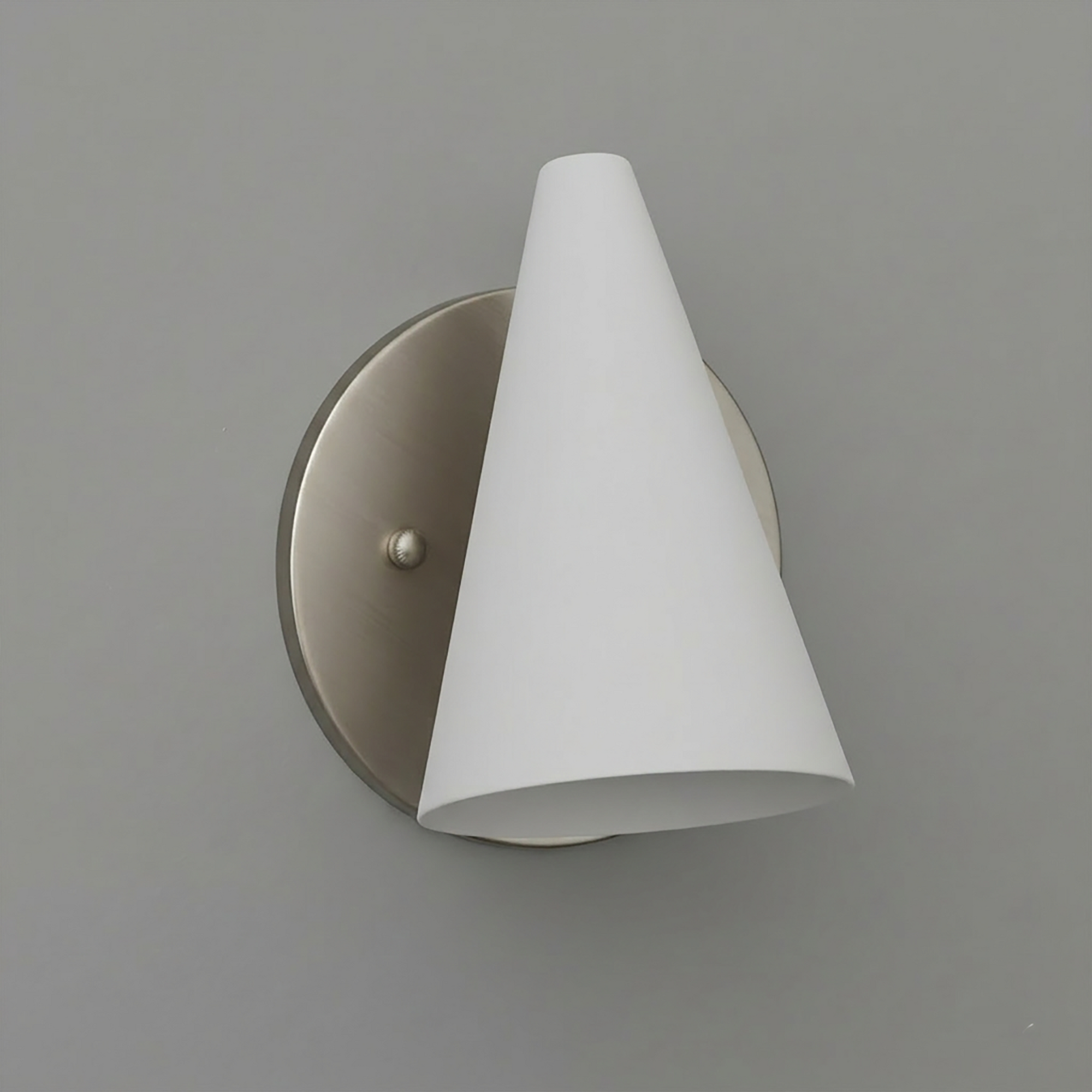 Brushed nickel wall sconce with a single white conical fabric shade and round backplate. - SCONCE MODEL NO. 5950