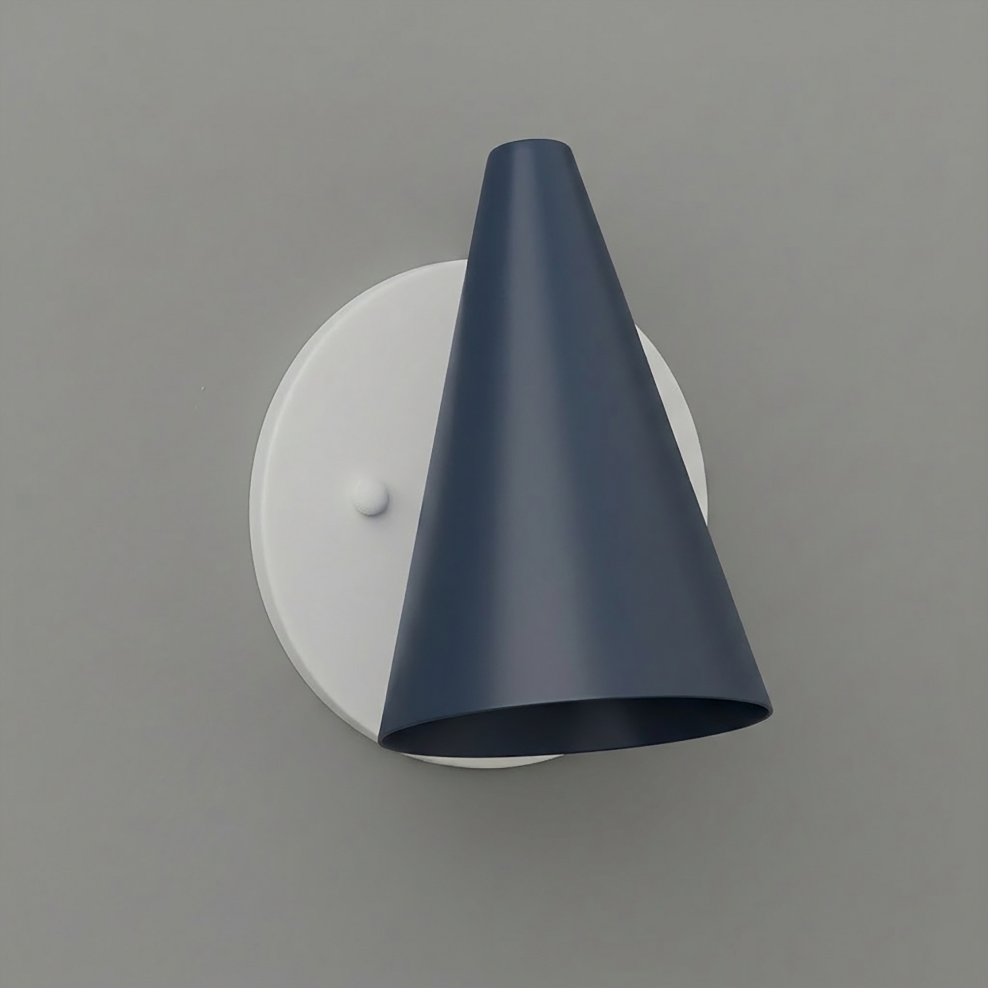 Matte navy blue conical metal sconce shade mounted on a round white base with a small white knob. - SCONCE MODEL NO. 5950