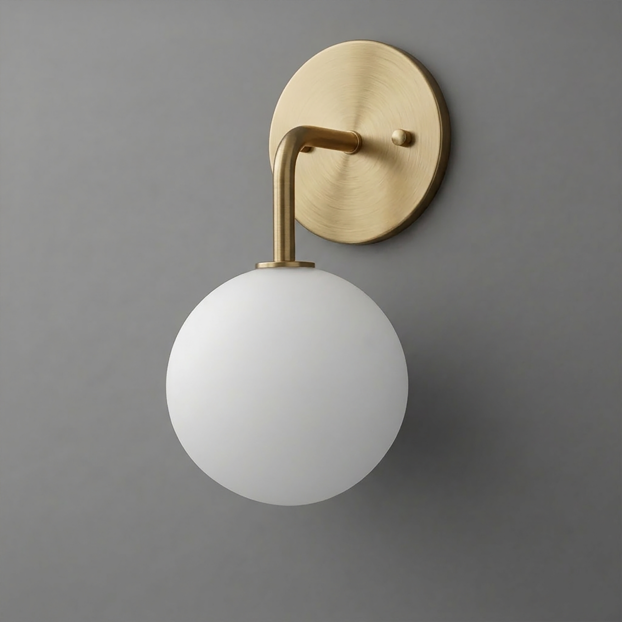 Brushed brass wall sconce with a round backplate and white frosted glass globe shade. - SCONCE MODEL NO. 7660