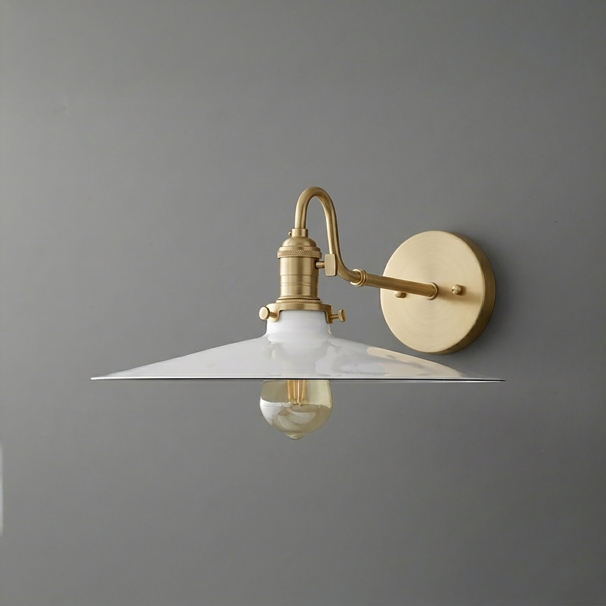 Wall-mounted brass sconce with wide white metal shade and exposed bulb. - SCONCE MODEL NO. 5562