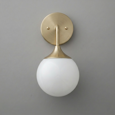 Brushed brass wall sconce with round backplate and white frosted glass globe shade. - SCONCE MODEL NO. 1752